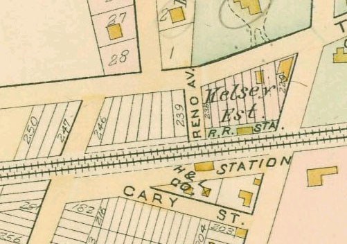 Old detailed map of a city with numerous buildings, numbered areas, and text, showing proposed development at the bottom.