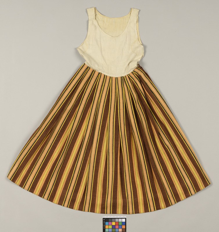 A full-length dress with alternating brown and yellow stripes on a white background, featuring a voluminous, flowing skirt and lightweight fabric.