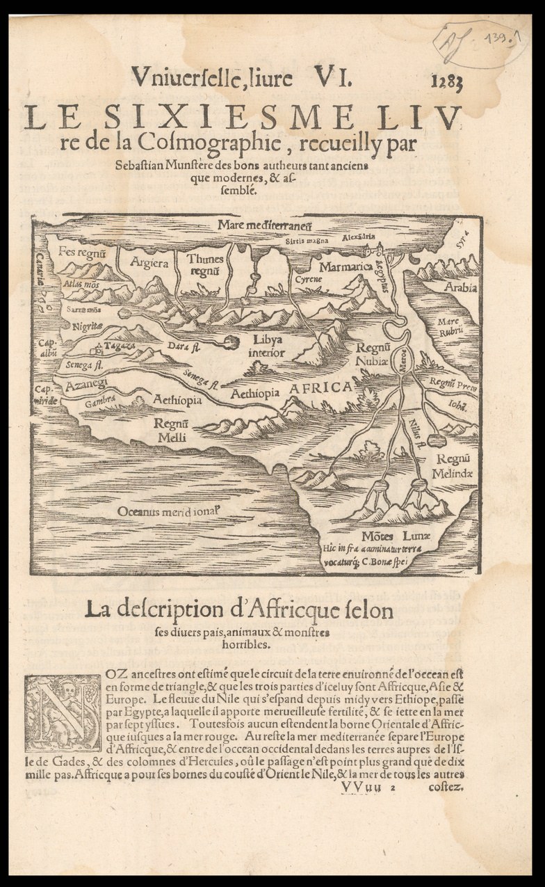 Old book with a detailed map of Africa on its cover, including geographical features and text, set against a black background.