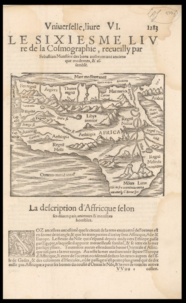 Old book with a detailed map of Africa on its cover, including geographical features and text, set against a black background.