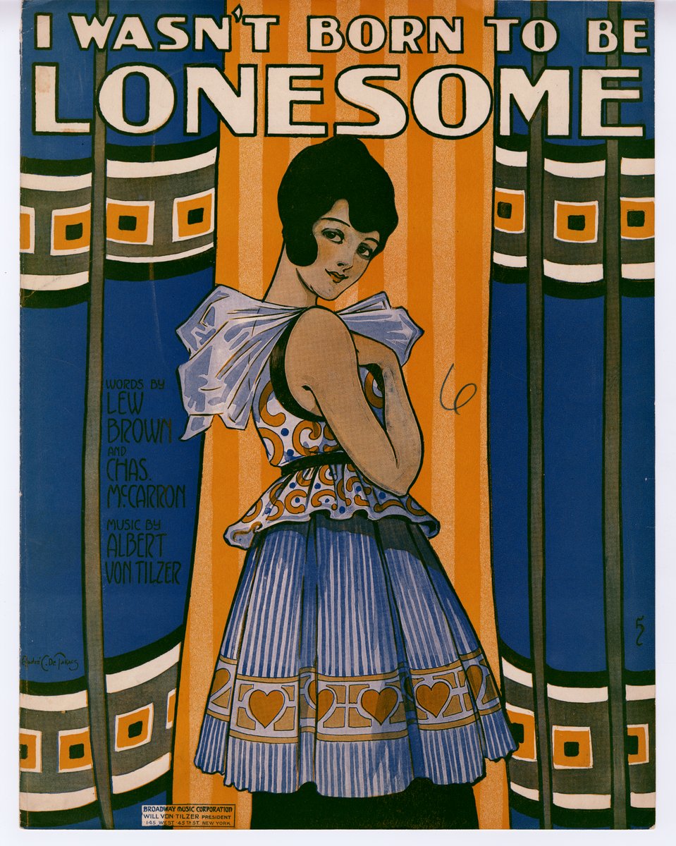 Eine Frau in einem weißen Kleid mit einem gemusterten Schultertuch, das Haar zu einem Knoten gebunden, hat einen sanften Gesichtsausdruck; der Schriftzug lautet "Ich wurde nicht geboren, um einsam zu sein" vor einem hellblauen Hintergrund mit verstreuten Sternen.