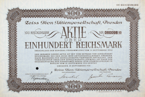 Ein altes deutsches Wertpapier mit schwarzem Rand und der Inschrift "Aktie über Einhundert Reichmark"