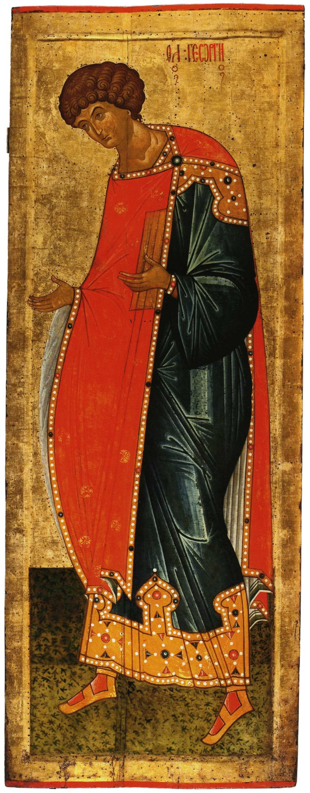 Gemälde einer Frau in einem roten und schwarzen Kleid, wahrscheinlich die Mutter Gottes, die mit gefalteten Händen betet, den Kopf gesenkt, die Augen geschlossen und das Haar zu einem Dutt frisiert, vor einem tiefblauen Hintergrund mit goldenem Text.