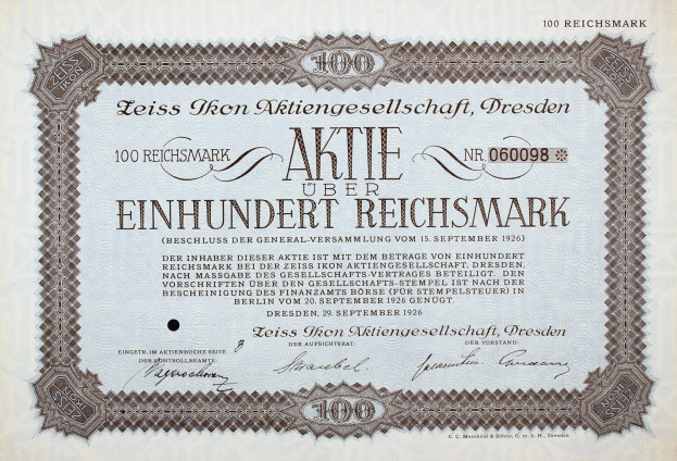 Old German stock certificate for 100 Reichmarks with black border and printed text.